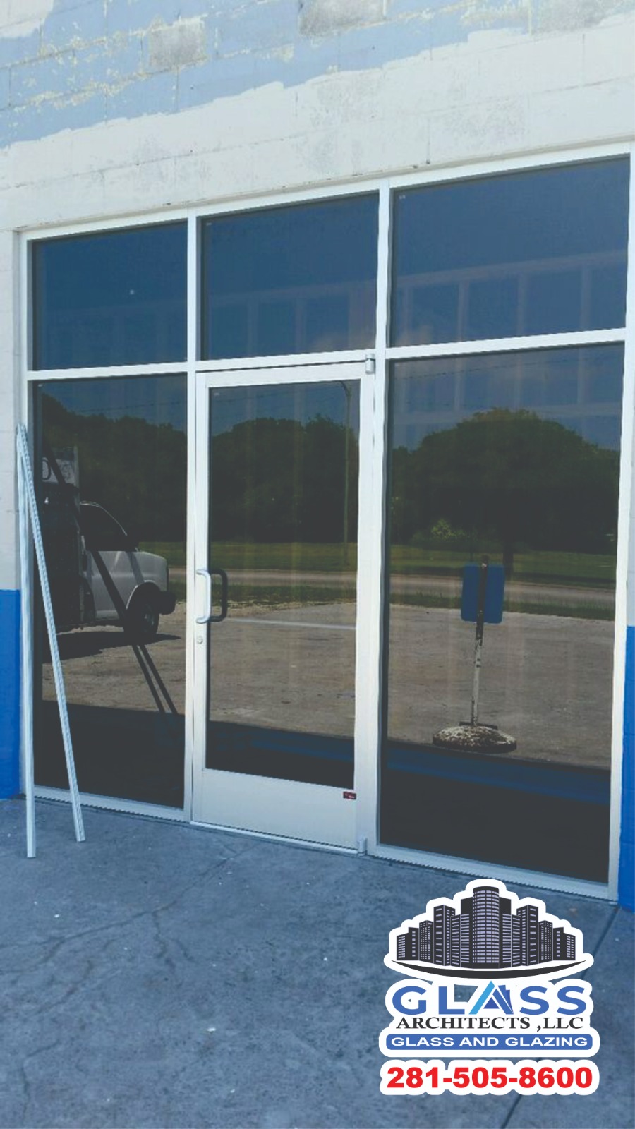Branded storefront double glass entry doors with finished pivot hardware installation