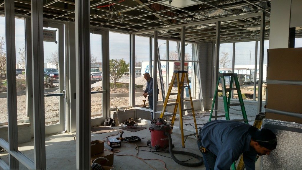 Active restaurant lobby glass and partition installation under progress by Glass Architects LLC